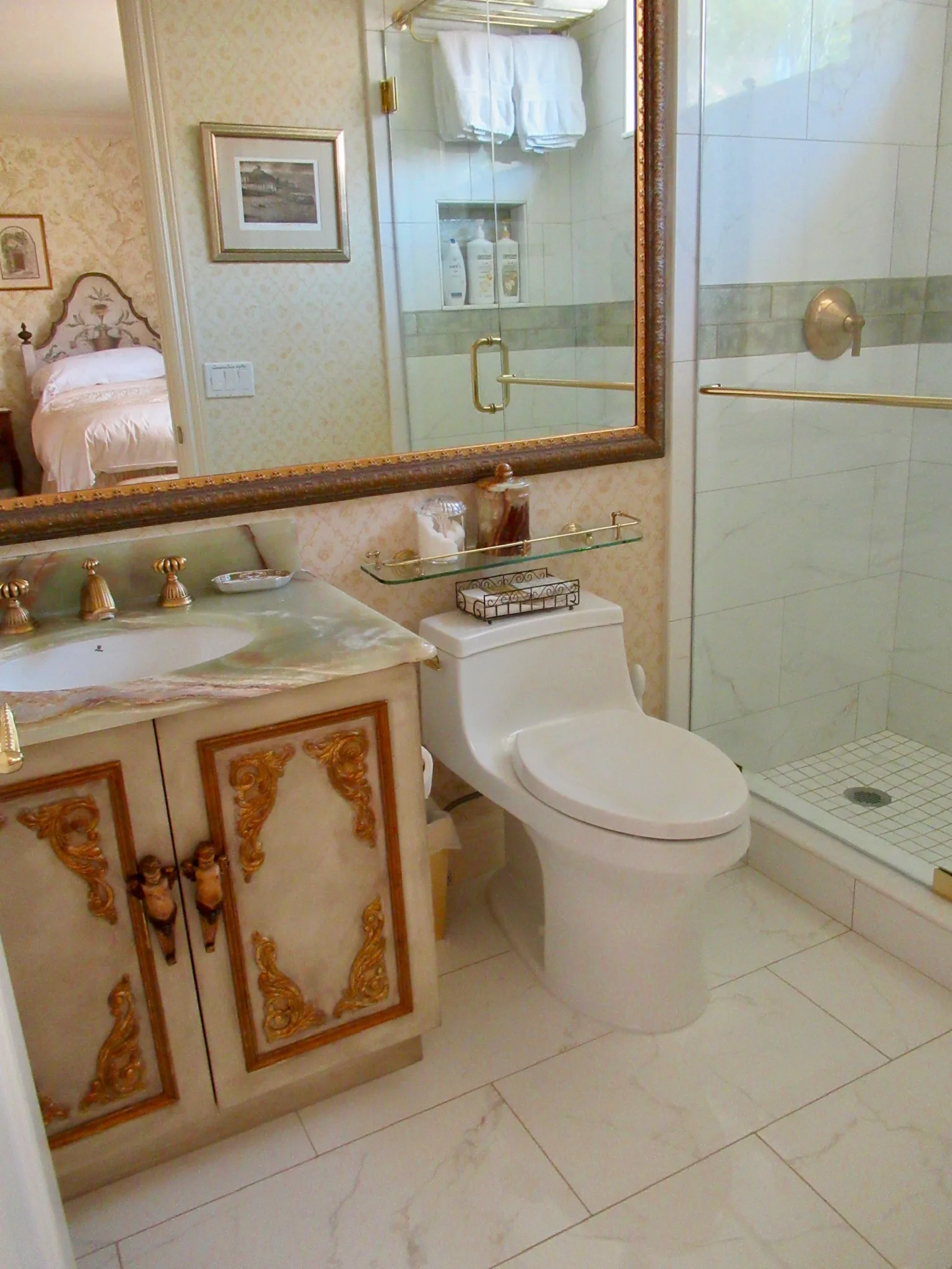 Bath with gold accents and a glass shower — Casa de Marbella, Palm Beach Gardens, FL