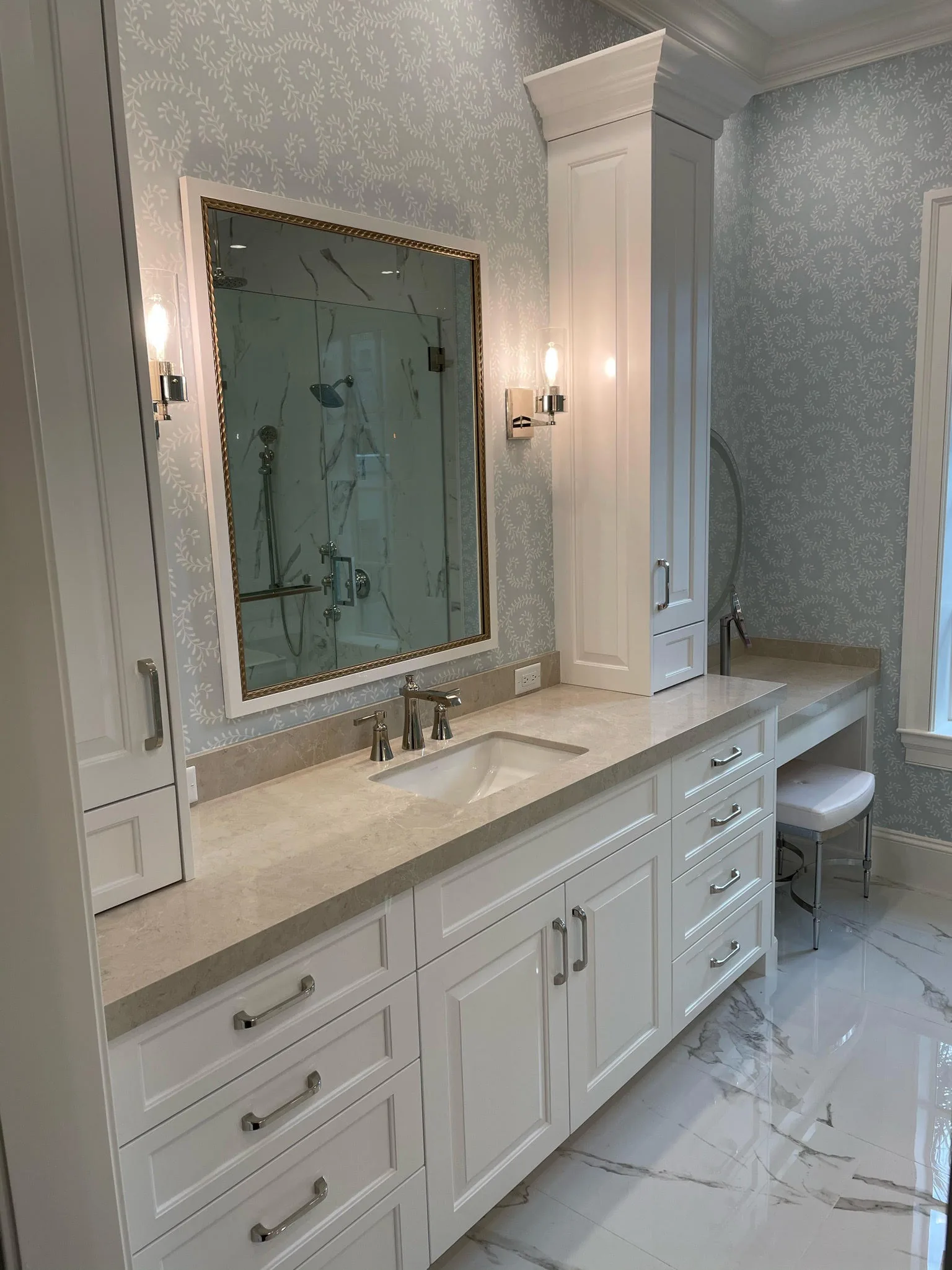 Bath vanity with white cabinetry and marble floor — Loxahatchee Club, Jupiter, FL