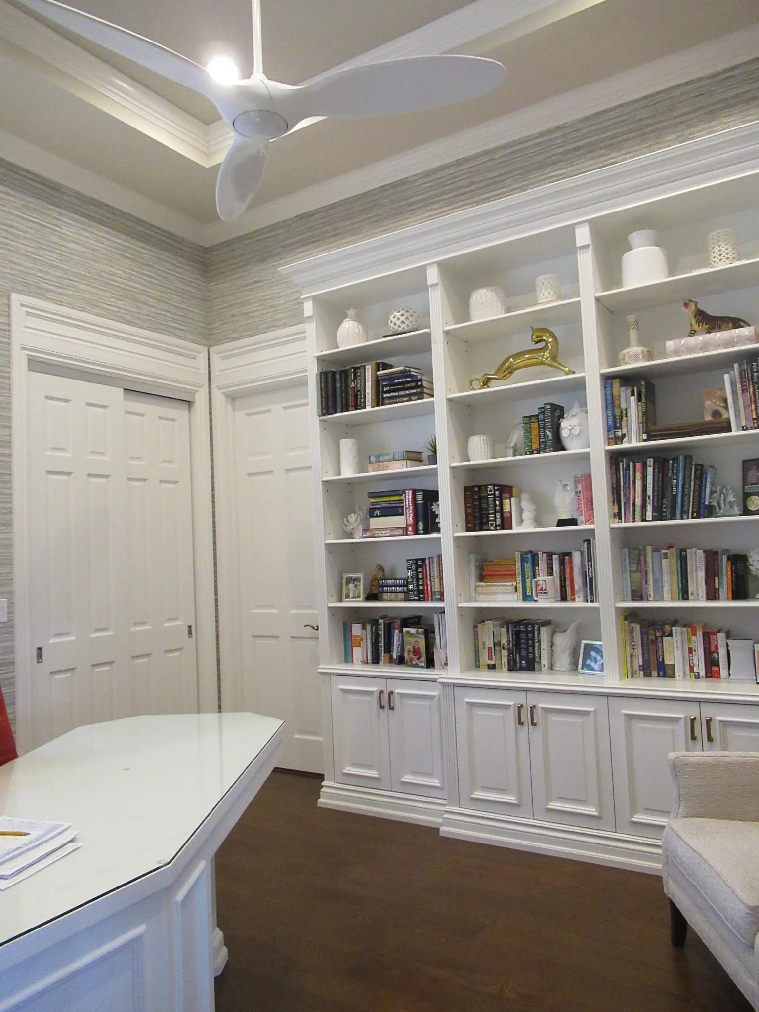 Home office with white built-in shelving — Loxahatchee Club, Jupiter, FL