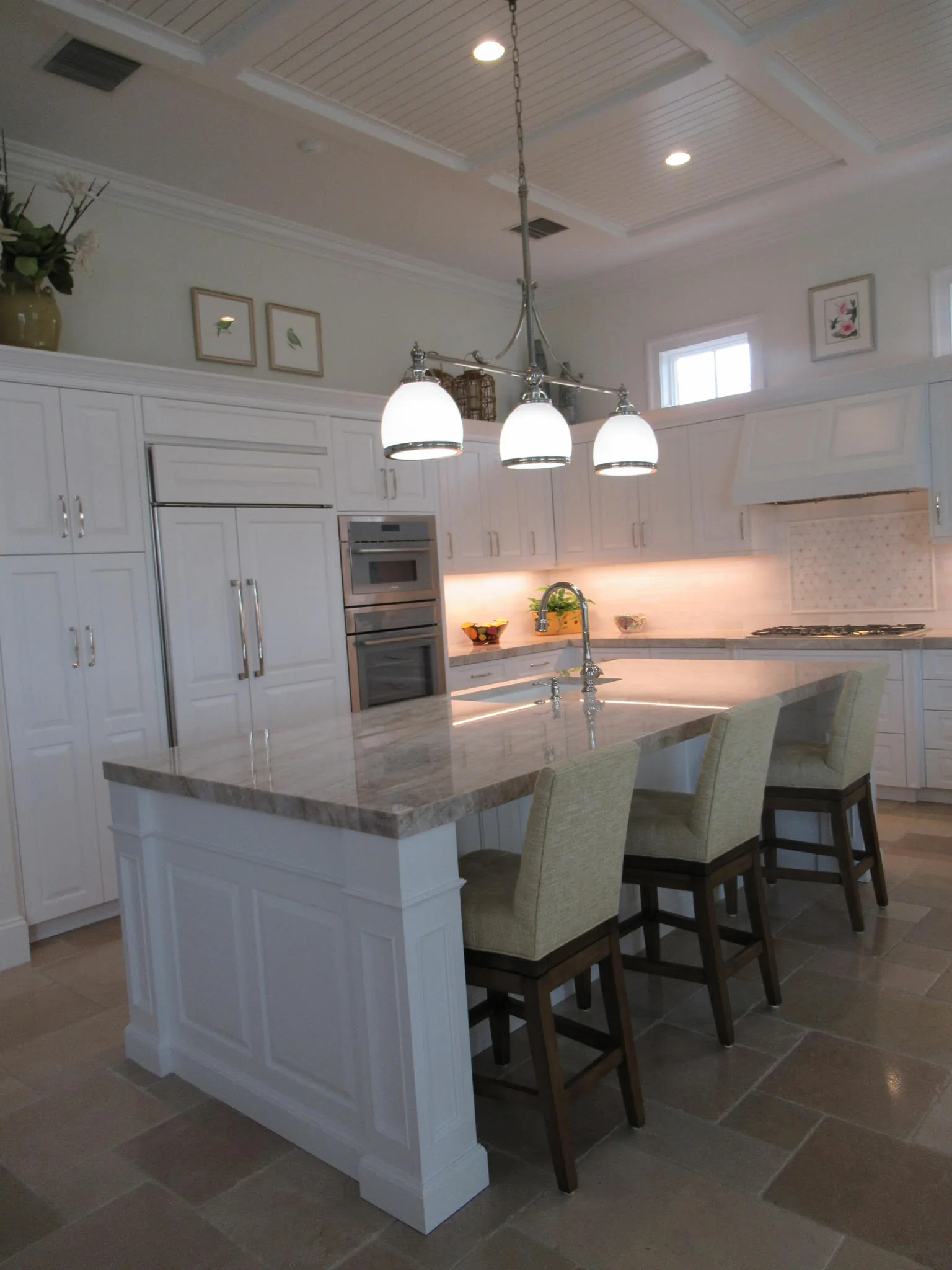 White kitchen with island and pendant lights — Loxahatchee Club, Jupiter, FL