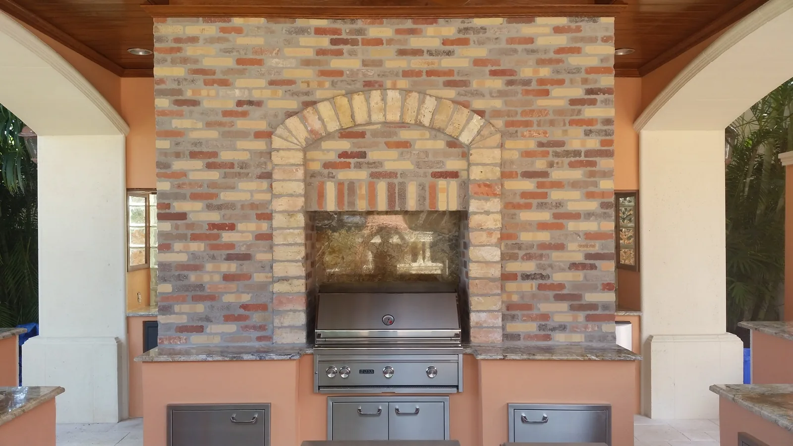 Outdoor grill set into a brick arch — Casa de Marbella, Palm Beach Gardens, FL