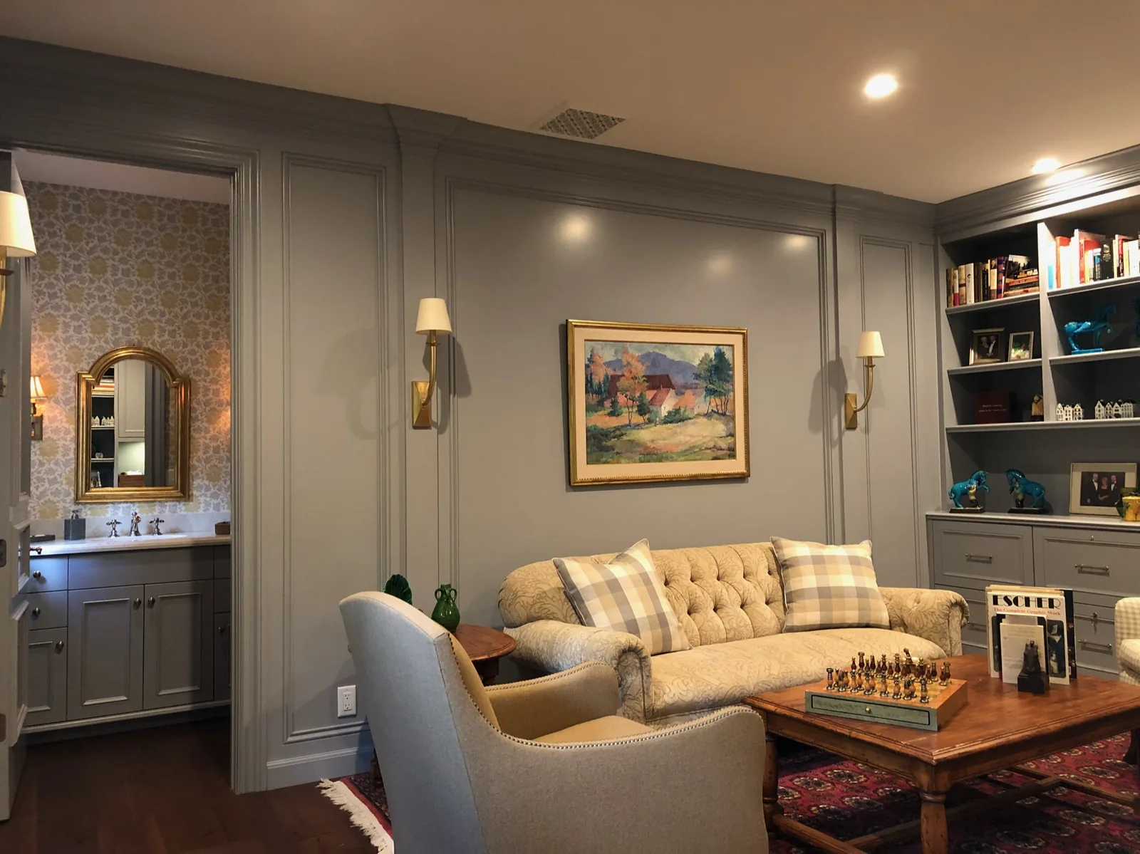 Sitting room with gray paneling and built-in shelving — Loxahatchee Club, Jupiter, FL