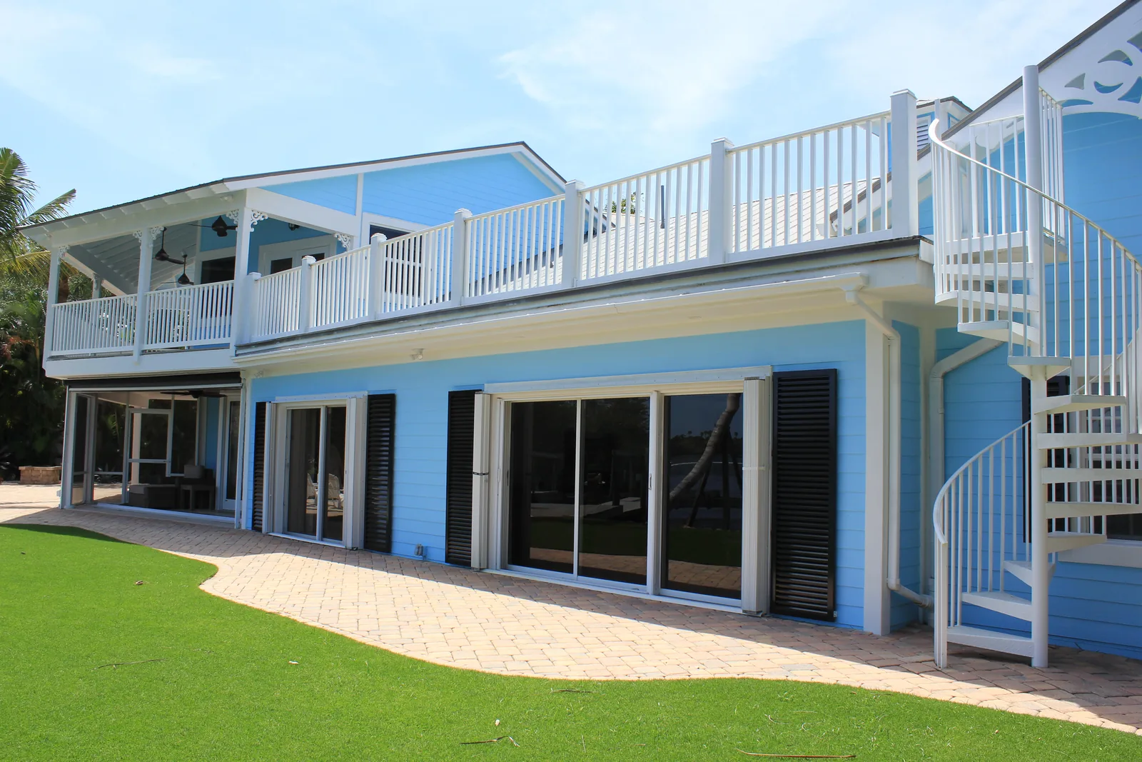 Waterfront residence with wraparound porches and an exterior spiral stair — Indian River, Hobe Sound, FL